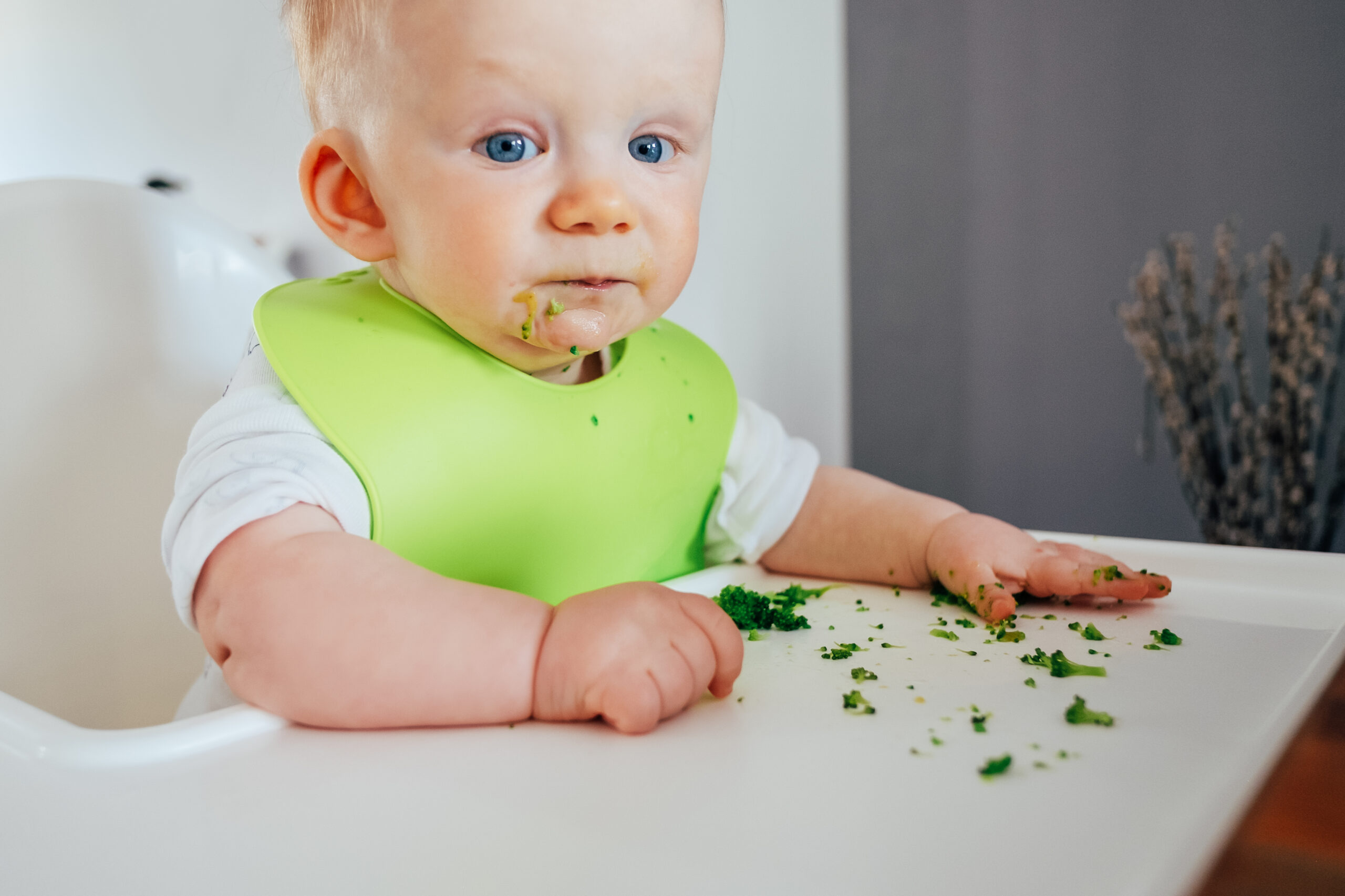 cute baby messing while eating